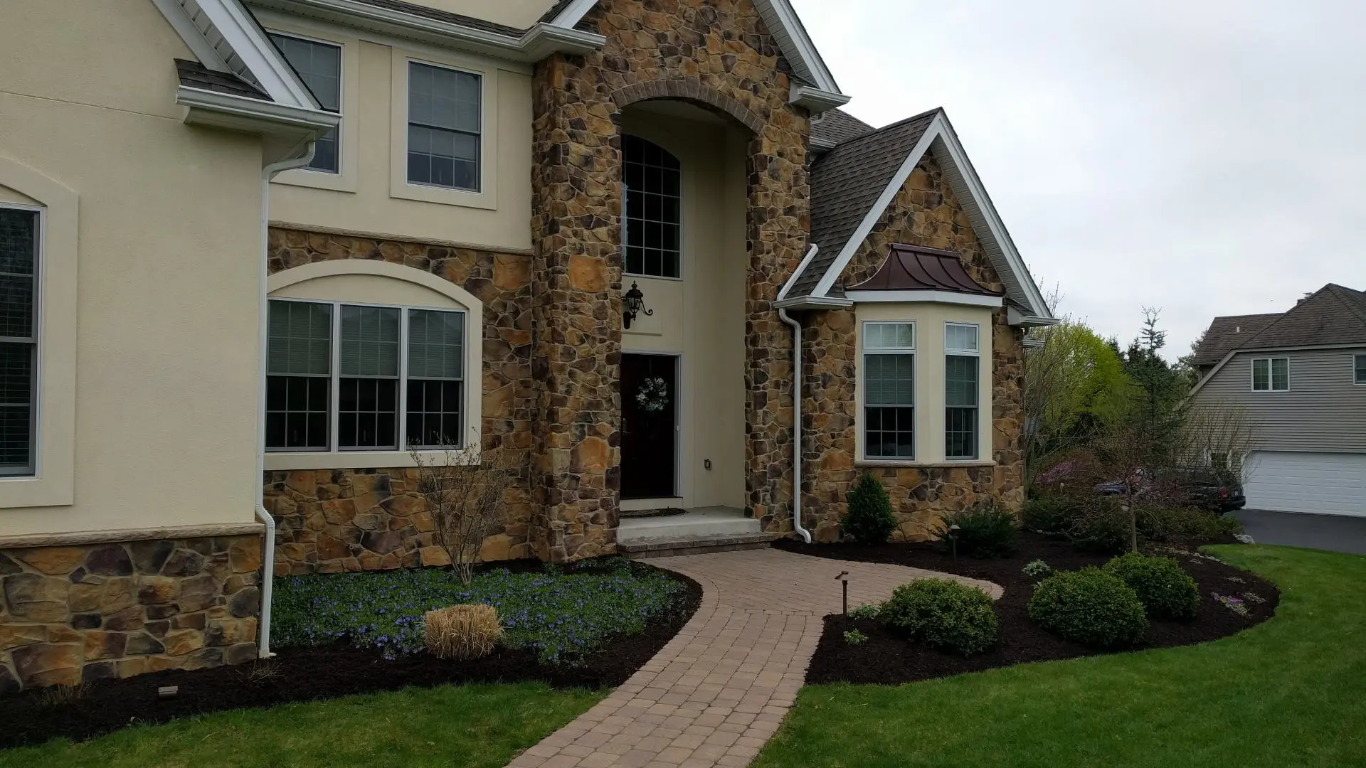 Large home with maintained landscaping in Orefield, PA.