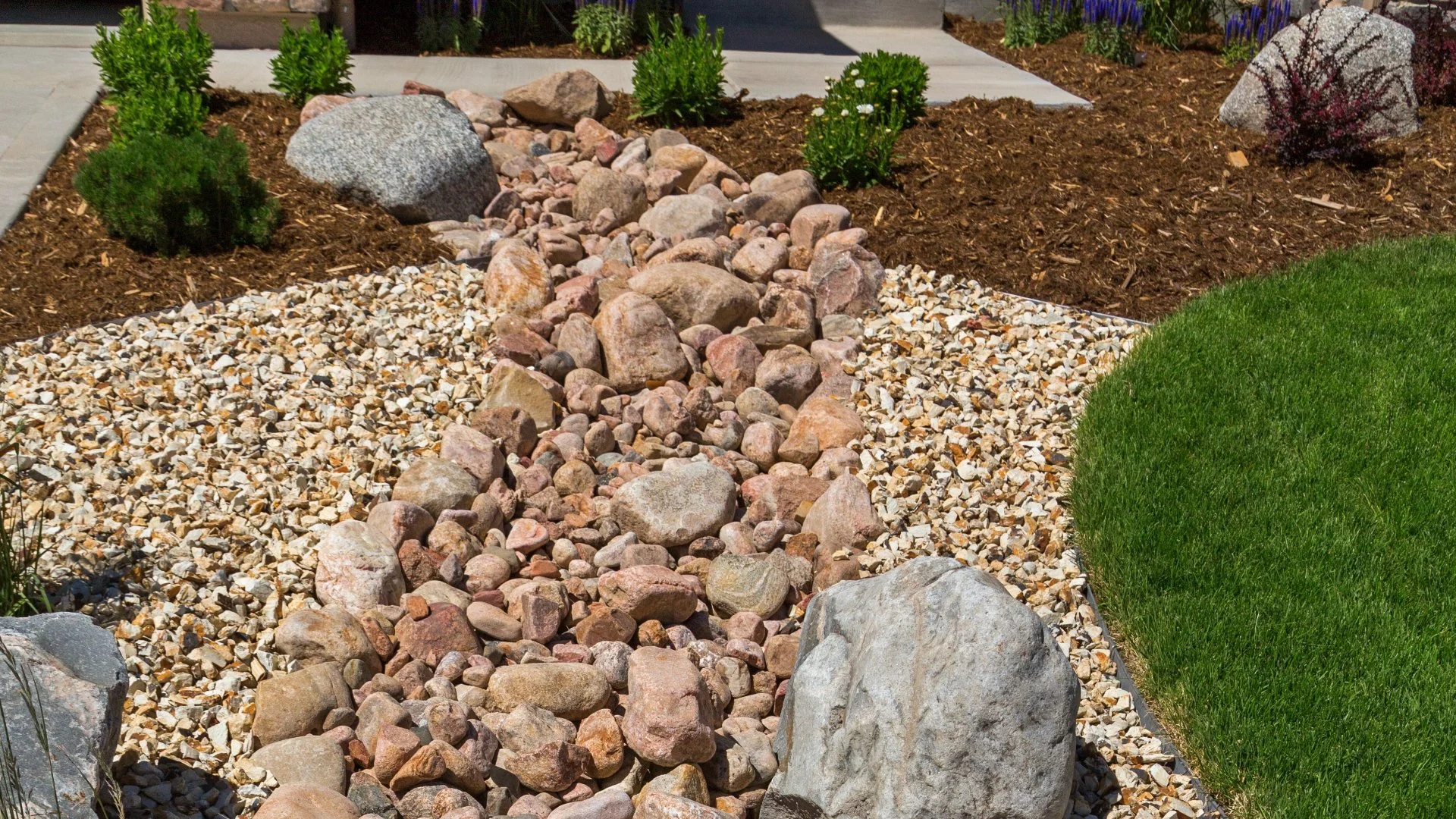 How Do Dry Creek Beds Help With Yard Drainage?