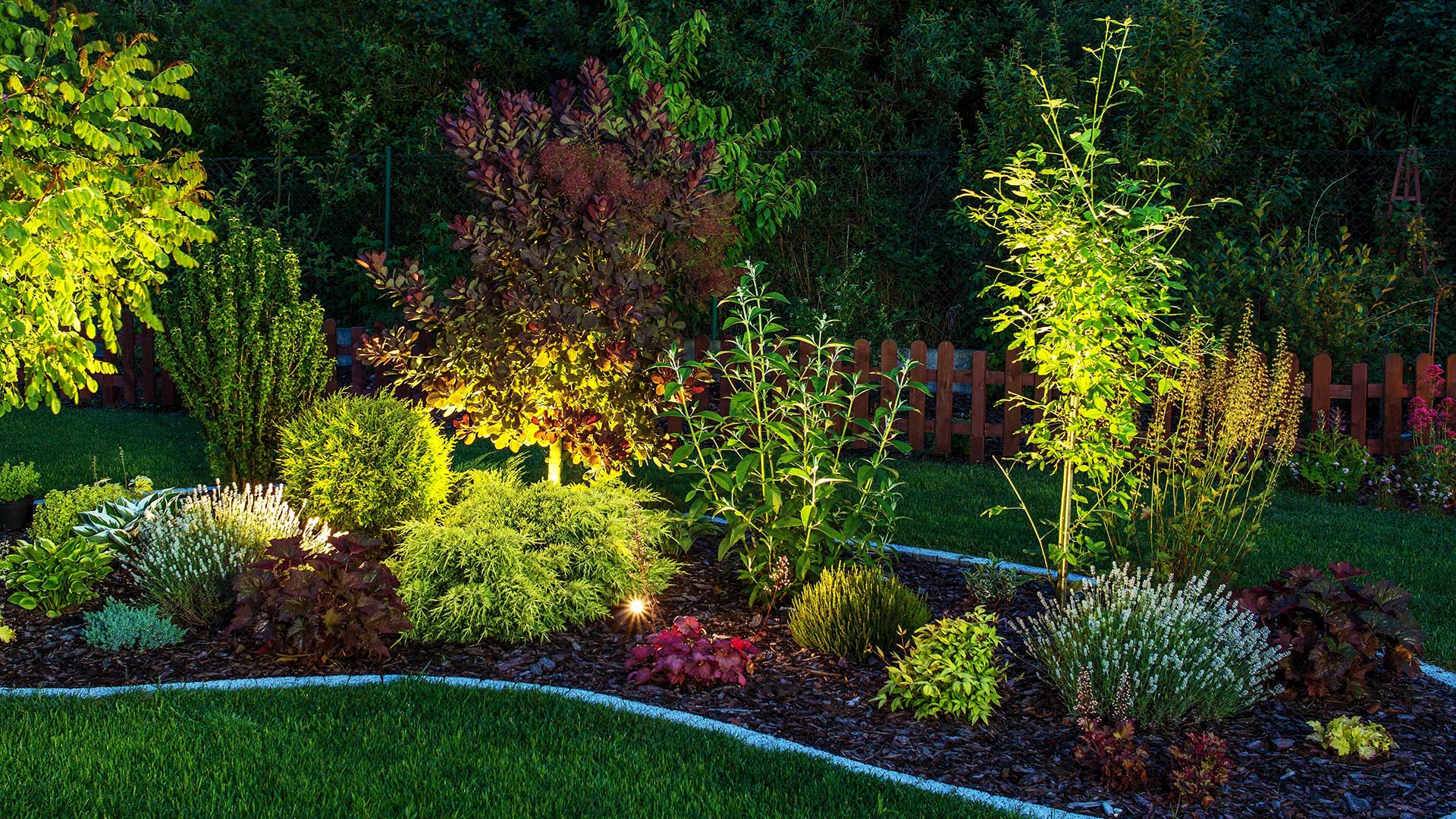 A landscape bed with lighting installed on a property in Center Valley, PA.