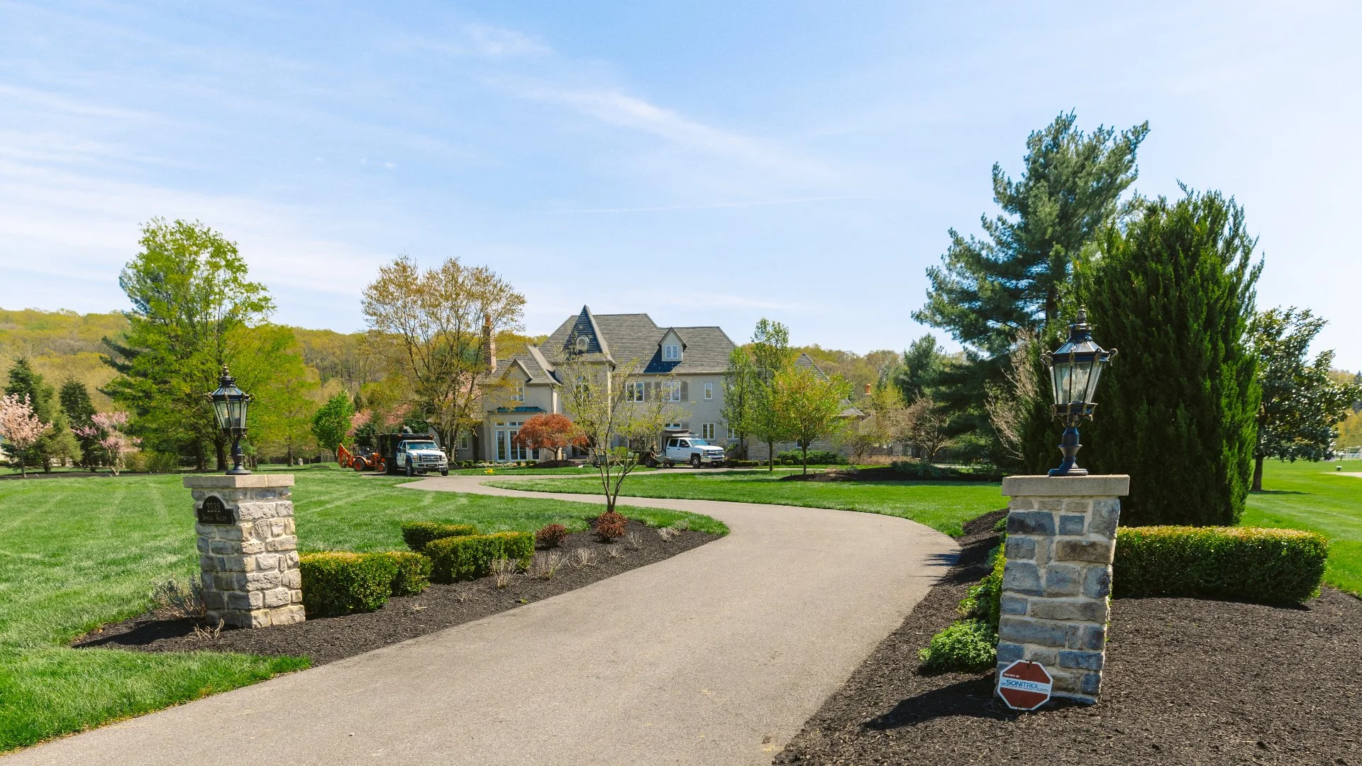 Scenic walkway surrounded by a lush lawn and vibrant landscaping, creating a beautiful outdoor pathway in Nazareth, PA.