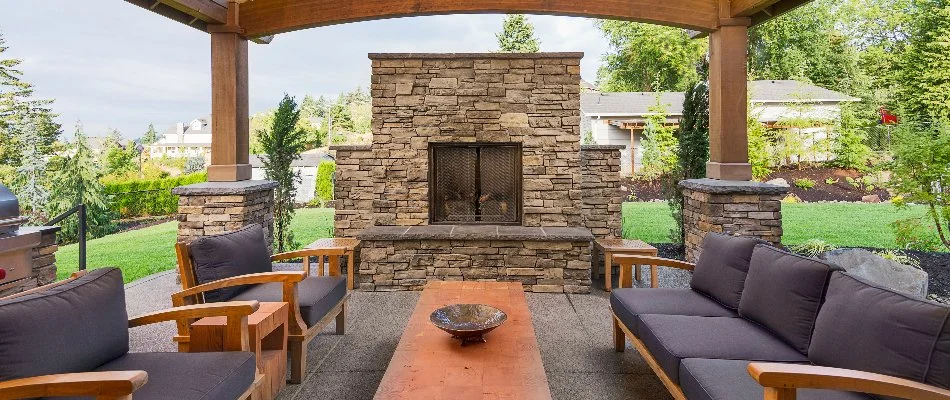 Outdoor fireplace in Macungie, PA, with a screen under a pavilion.