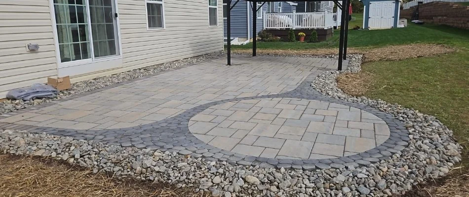 Paver patio in Macungie, PA, with landscaping rocks.