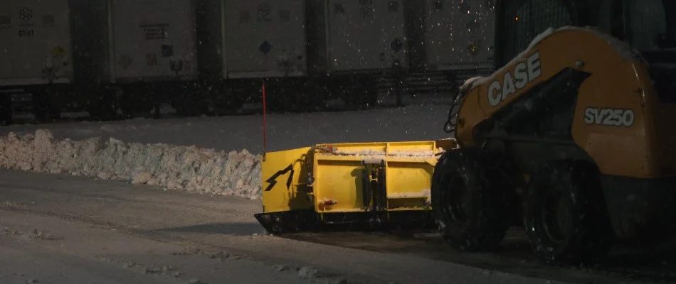 Snow plow removing snow from a road in Macungie, PA.