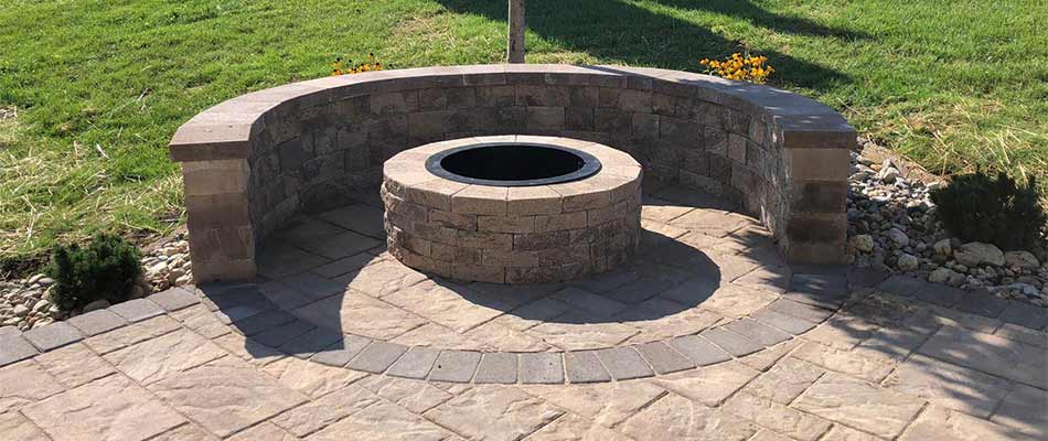 Custom fire pit and stone patio installed at a home in Allentown, PA.