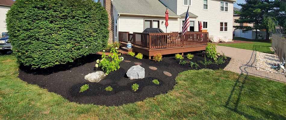 Emmaus, PA home with a landscape bed with fresh mulch.
