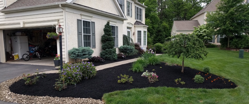 Landscape bed installed with plantings and mulch in Macungie, PA.