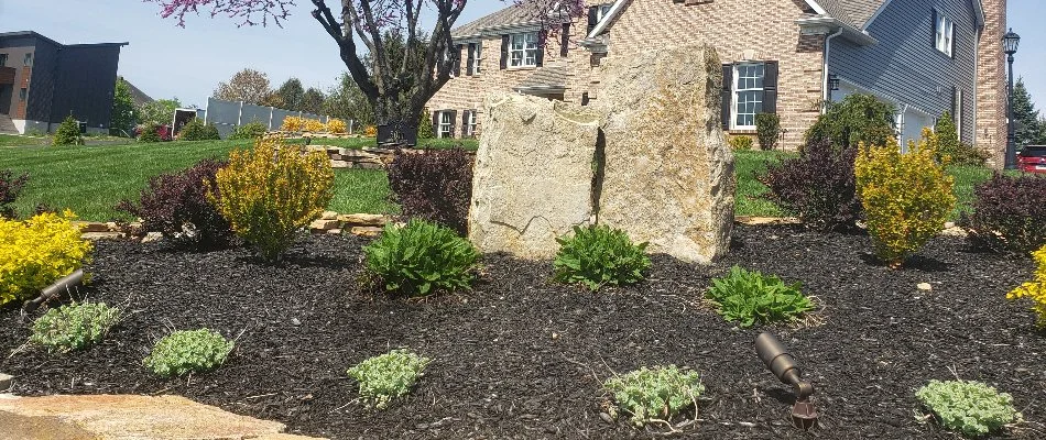 Landscape bed with mulch and plants in Catasauqua, PA.