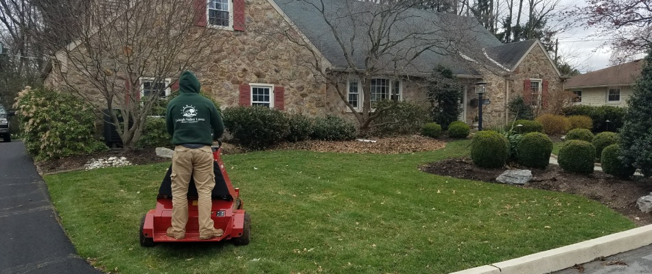 Lehigh employee servicing lawn during the fall season in Coopersburg, PA.