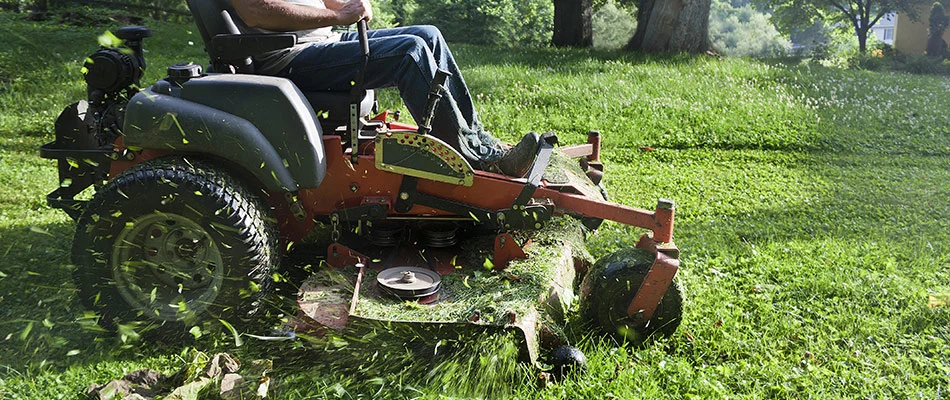 A professional mowing lawn in Wescosville, PA.