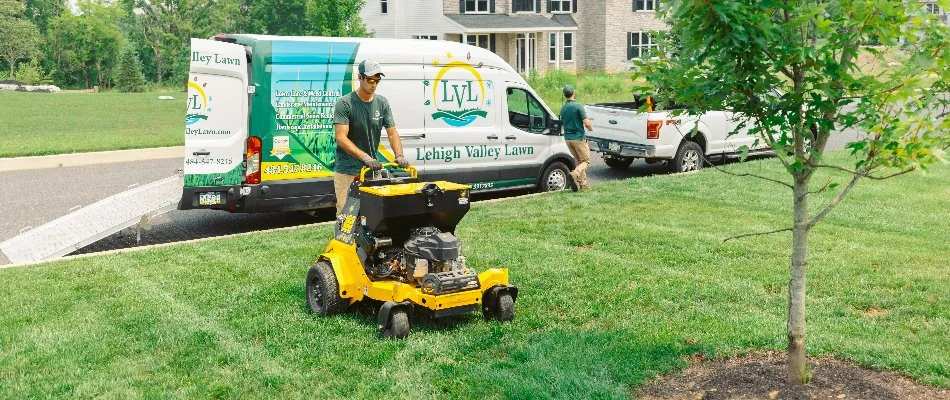 Worker aerating a lawn on a property in Macungie, PA.